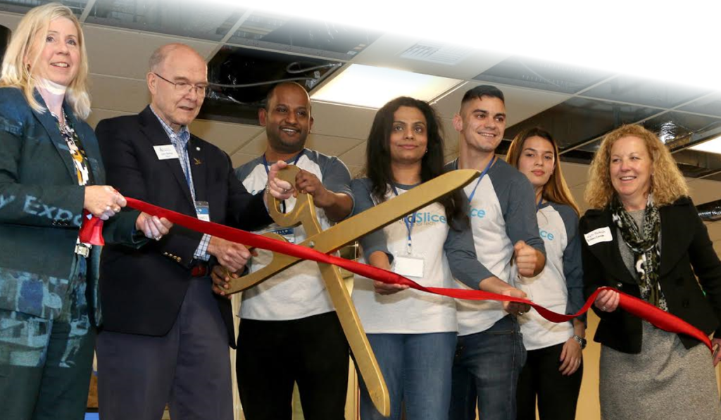 Pictured from L to R: Betty Capestany, Belleview City Council, Mayor John Stokes, City of Bellevue, Binu Reghunathan, Meghana Subramanian, Nick Stacy and Loren Villarreal Diaz from extraSlcie and Kim Fredericks, Bellevue Chamber of Commerce.